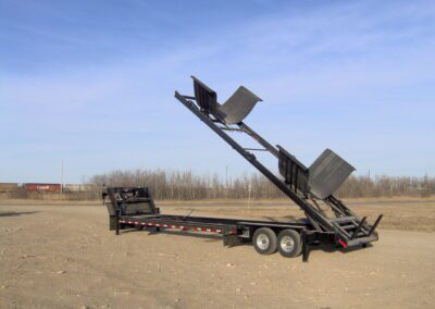 A bin transport trailer with the bed fully extended.
