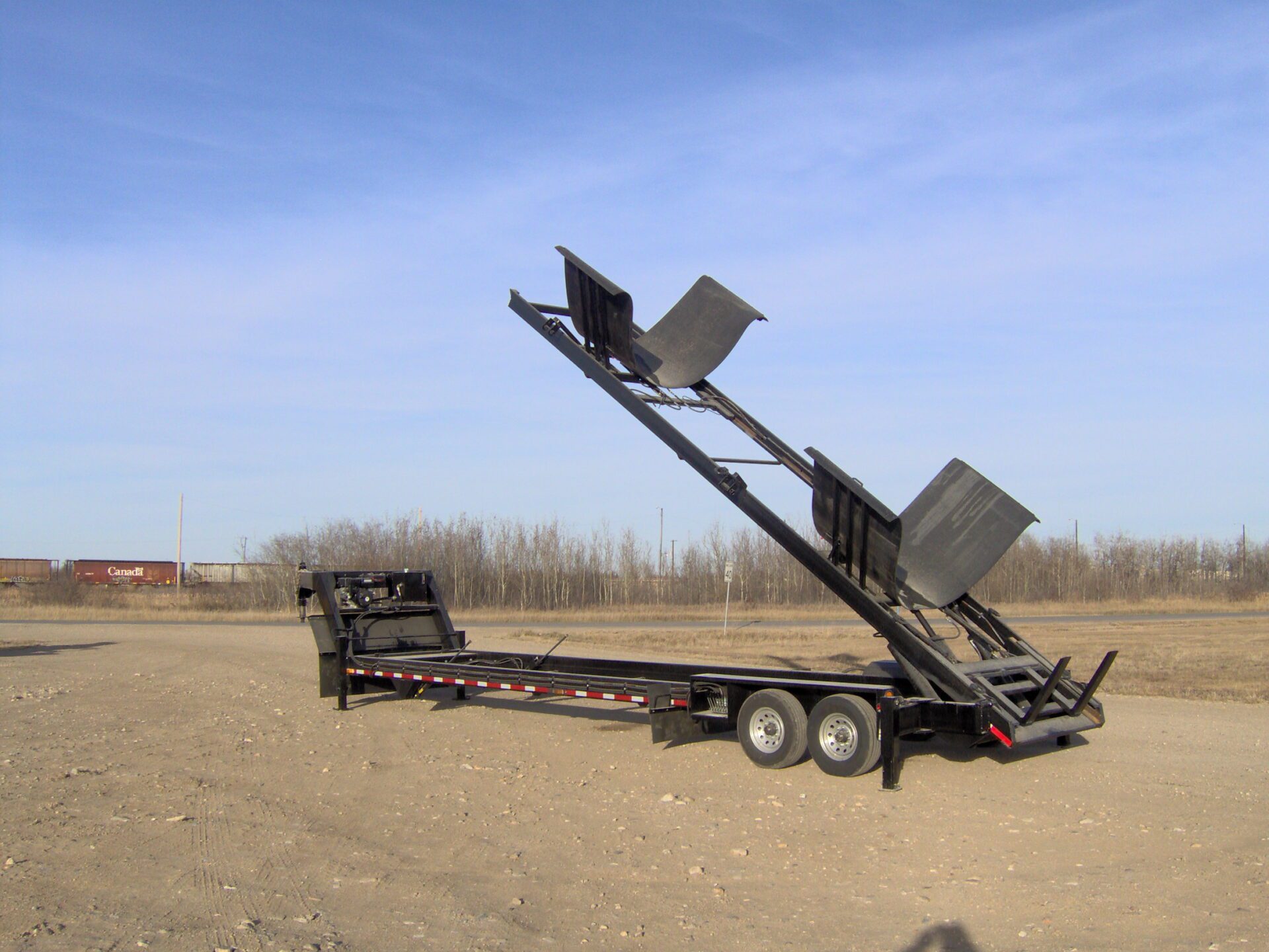 An empty transport trailer by itself fully extended.