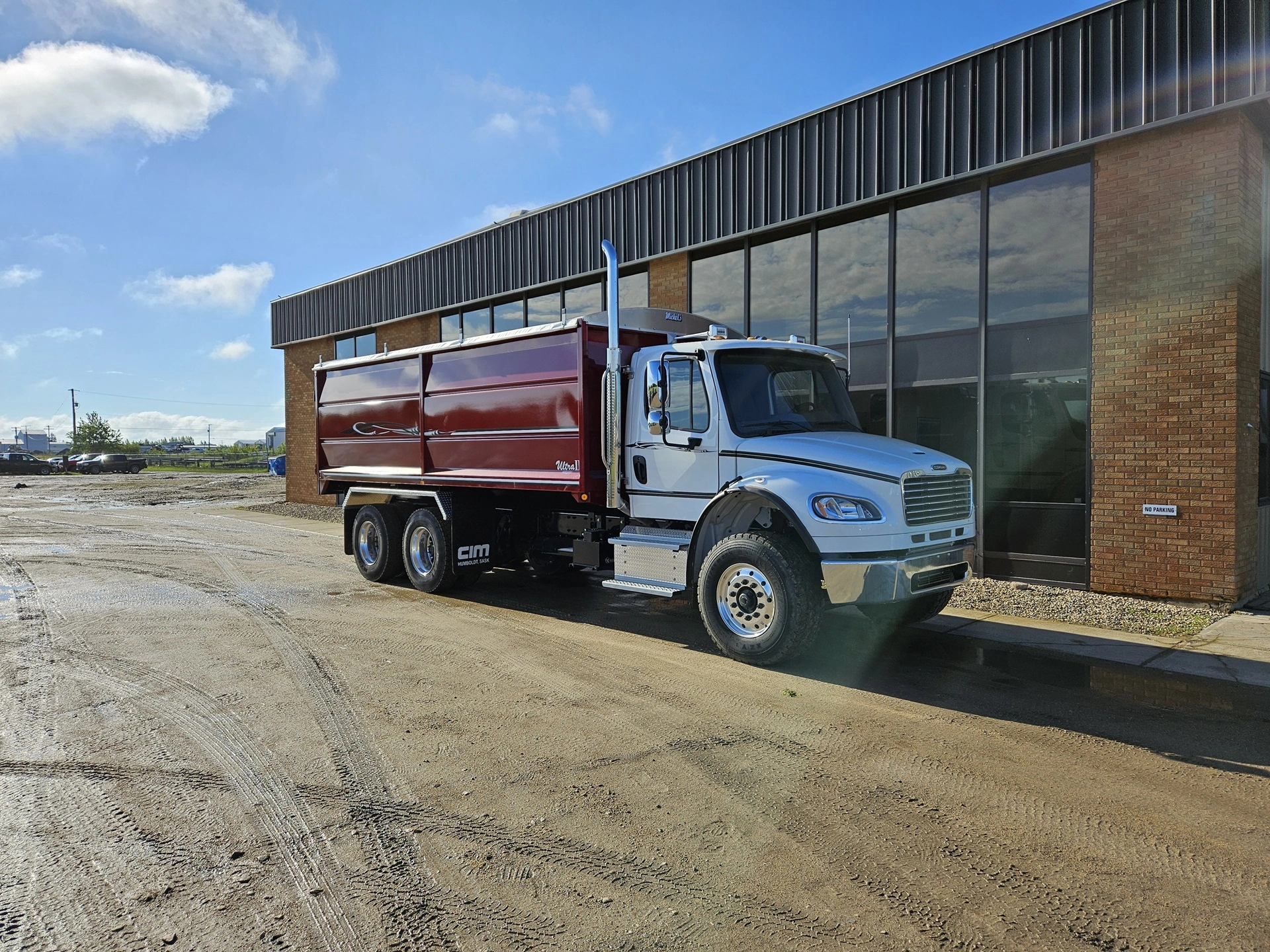 An Ultra II Grain Body waiting outside a Humboldt, SK property.