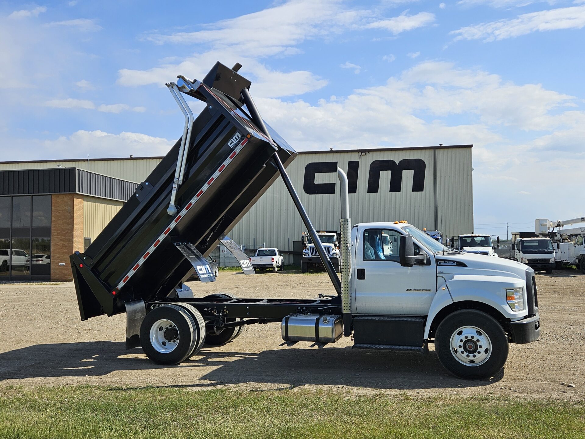 A gravel truck with the bed fully extended.